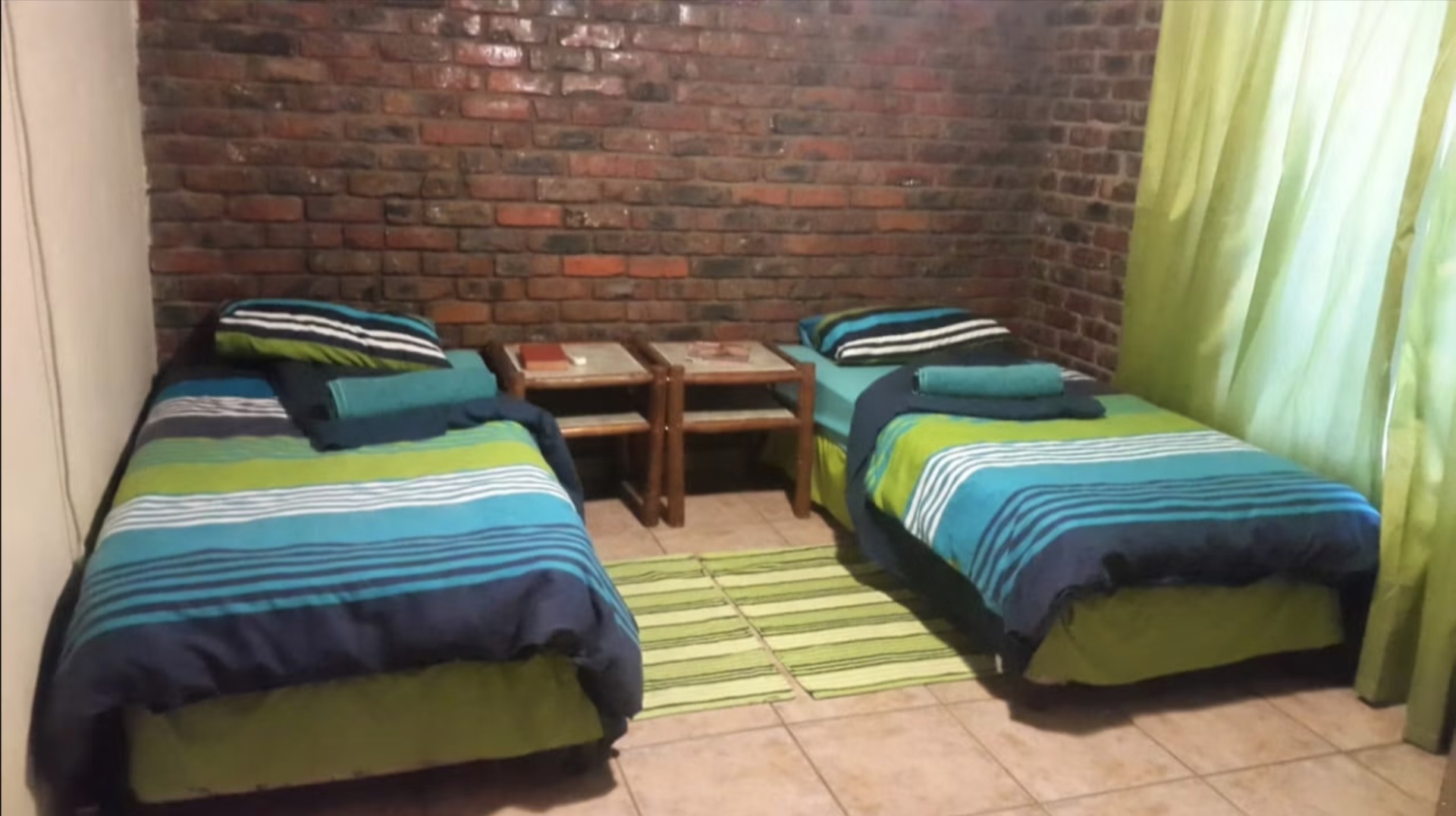 Unit 1 · Twin bedroom (blue-green linen)