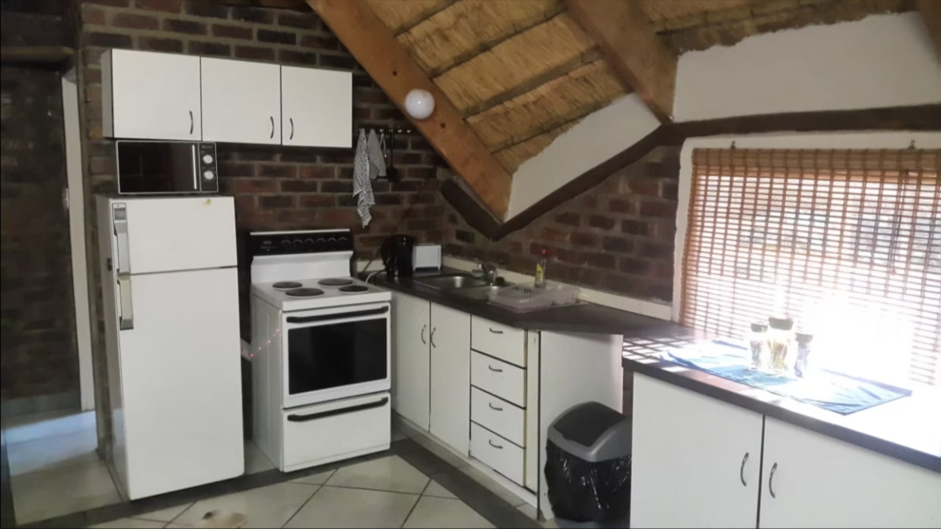 Full self-catering kitchen under the thatch in Unit 3 at Do-Drop-In