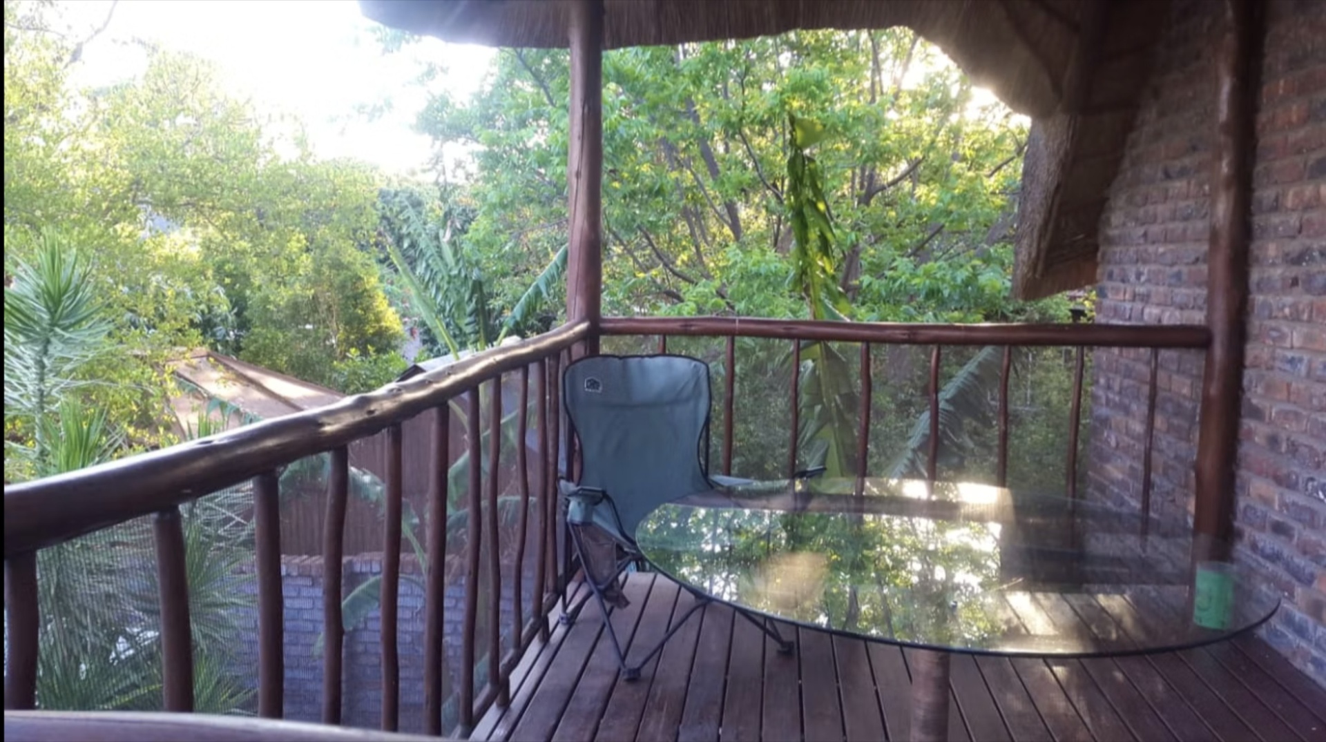 Private balcony with treetop views at Do-Drop-In Unit 2